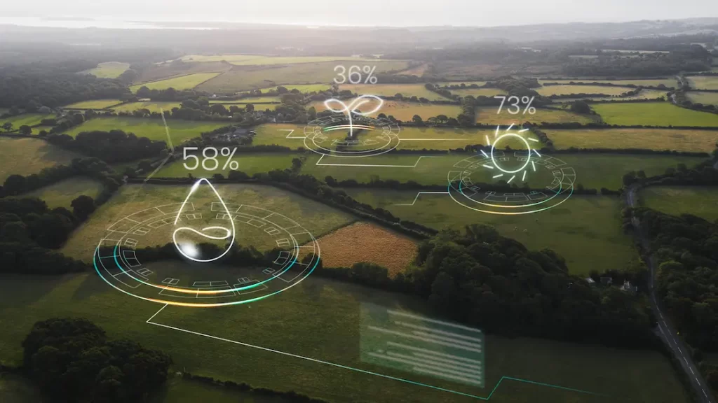 Vista aérea de campos agrícolas con sensores IoT que monitorizan humedad, crecimiento y rendimiento de cultivos en tiempo real